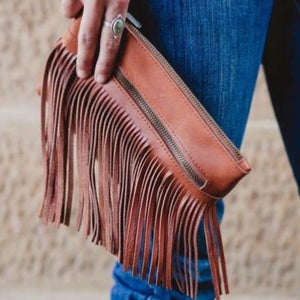 The Dallas Clutch - a beautiful leather fringe clutch that packs western punch! It’s perfect to carry your essentials in style. Compact and stylish, made for those that wish to carry light.