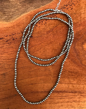 These sweet designs are the lone strand of mini 4 & 5mm Navajo Pearls. Stunning choker or short style necklace. The clasp comes with a 1" extension chain so you can play with the length a little.   Available in 14 & 16 inch to suit your style.