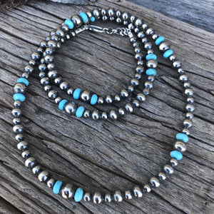 These are genuine Navajo Pearls, handmade by artists who have been making these pearls for generations. Each Pearl bead is plated in .925 sterling silver, antiqued & polished creating a shimmering, perfect Navajo pearl!  This gorgeous design is the full 34” length with 6mm 8mm and 10mm Navajo Pearls with Turquoise bead accents and clasp in silver. 