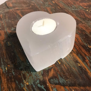 Western lovers will really enjoy these genuine Selenite stones that have been shaped into a heart.   This natural white gemstone has a pearly ‘Moon like Glow’ to be admired  Each has been hand-carved by talented Artisans with single tea light hole. No two pieces will ever be identical, which is part if their natural beauty.  Beautiful gift idea that you’ll want to keep for yourself! Heart of genuine Selenite gemstone.  Approx size 9 x H3.5cm.  Each is a little different. Sold as each.