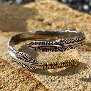 Southwest style, detailed feather 🪶 cuff  This cuff features full detailed silver band with gold rope accent at one end.  Artisan .925 Silver.