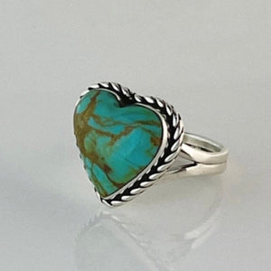 This adorable heart ring was made by Navajo artist Alfred Joe and is set with # 8 turquoise. The heart cut stone is set in a smooth sterling bezel and accented with sterling twist rope. Stamped.  Size of Setting: 3/4” by 3/4 ”Heirloom item.  One of a kind collectors item to be worn, admired and treasured. 