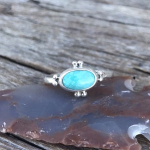 The Stone: A natural Royston Turquoise gem with a full matrix of azure blue and natural accents.  The Ring: Dainty oval shape in .925 silver, Southwest detail and simple silver band. Artisan crafted in Australia using quality USA/Arizona Turquoise. ‘One of a kind’. Easy to wear.