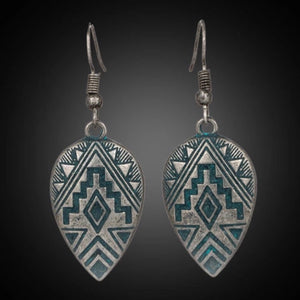 You’ll be the envy of you besties in these Navajo inspired earrings.  Artisan made. Mexico.  Etched Aztec design with gorgeous patina blue on burnished silver.  Lovely weight and size to wear all day.