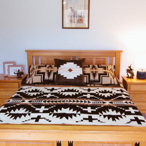 Bring style to your room with this iconic Pendleton throw.  Pendleton's Spider Rock throw blanket is just the right size for napping, reading or simply admiring. Toss over a sofa or chair, or fold at the foot of the guest bed. The intricate, Native American-inspired design is sure to be a conversation starter wherever it lands. Woven in Pendleton's Northwest mills. Swan Creek Interiors Australia.