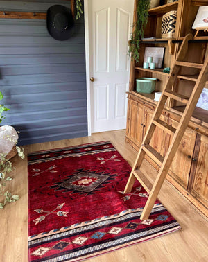 Perfect for all the home and ranch living.   These microfibre (mat) rugs can be used to spice up a room or simply provide the finishing touch to any space. Light weight, easy to clean and quick drying. You can even spruce up the patio or gooseneck with these more affordable rugs.  The Red Chimanno rug features, Southwest Navajo inspired  ‘Arrows and Chevrons’ design in deep red. This design is perfect in ranch styling or add a bold twist to your modern rustic home.  Grande 71” - Approx 120x180cm 