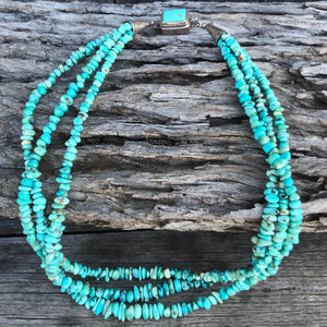This necklace stands out from the rest!  Stunning Lone Mountain Turquoise necklace features; 3 stunning strands of natural blue nuggets finished with .925 sterling cones, with handmade sterling silver and Turclasp.  Beautiful length, 19" necklace with graduating 4 to 7.5mm Lone Mountain Nuggets. 