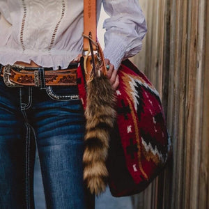 Western Fox tail with clip.  Very good replica, you’ll never know the difference. Clip one of these baby’s on to your favourite bag, car keys or outfit for Cowgirl Cred! ❤️  Each is a little different, large size. Length approx 14” inches. Imported. Colour Brown and White  Colour Brindle and Black
