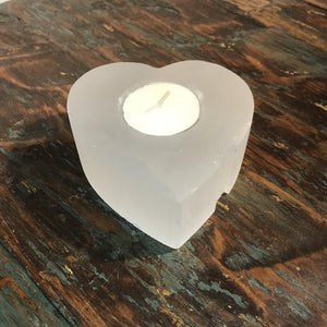 Western lovers will really enjoy these genuine Selenite stones that have been shaped into a heart.   This natural white gemstone has a pearly ‘Moon like Glow’ to be admired  Each has been hand-carved by talented Artisans with single tea light hole. No two pieces will ever be identical, which is part if their natural beauty.  Beautiful gift idea that you’ll want to keep for yourself! Heart of genuine Selenite gemstone.  Approx size 9 x H3.5cm.  Each is a little different. Sold as each.