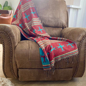 This versatile throw can be used to warm up a room, add glamour, texture or simply provide the finishing touch to any space. Perfectly sized for napping, admiring and worn as an Western shawl. (as seen in Cowgirl Magazine)  The design: Authentic Indian textile it features an tradition style ‘Western Cross’ design with hues of Turquoise, earthy red with tan and grey accents. Fully reversible accent so you can change your seasonal style.