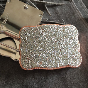 Western style buckle that Securely holds up to 5 cards.   The original Wallet Buckle USA  Securely Holds Up to any 5 Cards Slight Taper Pinches Your Cards to Hold Them in Place Access your Visa Cards, IDs, and even Cash in 2 Seconds  Quality Metal hardware 10 x 7.5cm. Fits any snap belt (we sell snap belts) Great for festivals, rodeo events and those nights on the town. You can ride bucking bulls and your cards won’t fall out! 