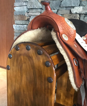 Display your Pride and Joy on this custom saddle stand, made here at Swan Creek in 🇦🇺 Solid Pine   Photos (high finish) Smokey oak blend stain with satin-poly finish. Top mount or full front Clavos - genuine Mexican nailhead accent. Comes with under rail hook.  Size 740mm High x 740mm Long x 320mm Wide  We make these to custom order - usually within the same week. (Christmas orders and events times may vary)  Options with variations of shapes for plaque mount, stain and painted finish available. By quote.