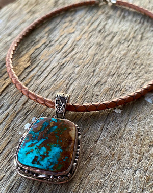 This large vintage pendant is stunning and even better in person.  * Pendant ~ Royston Turquoise with intriguing rich blues and copper brown matrix. {Nevada} Cabochon is set in handcrafted .925 sterling silver decorative pendant and bail.  Overall this pendant measures 1.75" ~ 27x24mm stonesize. One of a kind!  Vintage Pre 2000