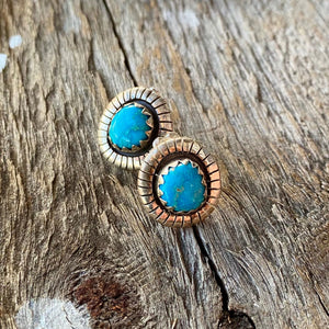 Southwest Stunners!  Bright blue Morenci Turquoise stones from Nevada .65" in overall length.  Natural setting with Southwest detail. Artisan made in New Mexico in sterling silver. Stud post with butterfly clasps. Measures 10x8mm.   These rare earrings are made to be comfortably worn, treasured and admired.