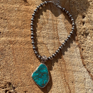 Big Beautiful Necklace Set  The Pendant; handcrafted by New Mexico Artisan, the pendant features a dazzling vintage piece of natural Lone Mountain Turquoise with bright teal-blue matrix and golden flecks. Made in pure silver the setting has bespoke detail. The big pedant size is approximate 5.5 x 4cm + the big bail.  The Chain; custom Navajo Pearls necklace especially for this pendant in 16” inch strand of 6 & 10mm pearls.