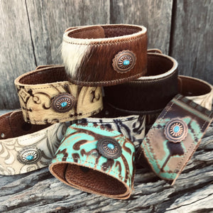 Vintage Western  Embossed leather cuff with traditional Southwest oval Concho   Handmade. Two layers of leather have been expertly stitched together. The inside leather is soft on your wrist. 