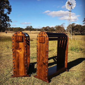 Display your Pride and Joy on this custom saddle stand, made here at Swan Creek in 🇦🇺 Solid Pine   Photos (high finish) Smokey walnut stain with satin-poly finish. Top mount or full front Clavos (genuine Mexican nailhead accent). Comes with under rail hook.  Size 740mm High x 740mm Long x 320mm Wide  We make these to custom order.