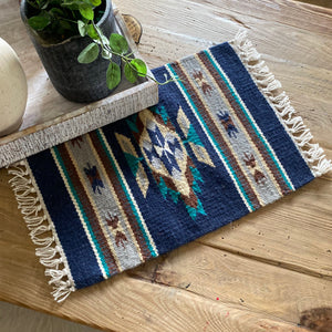 These beautiful hand loomed table mats are the perfect thing to spice up your table, sideboards, place settings, walls, anywhere and everywhere.  Each table mat is handmade by Mexican artisans from hand dyed 100% wool, measuring approximately 16x20".