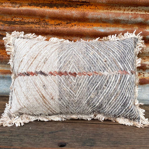 Modern Rustic Luxe  Introduce a rustic element to your homes interior with the Wild Roan lumbar cushion.  Featuring a diamond design on a soft cotton canvas, its multi-coloured fringed edging and textured woven surface creates a uniquely feathered visual effect. Its neutral grey palette with a touch of rustic warmth makes it easy to use the cushion to add depth to any interior.