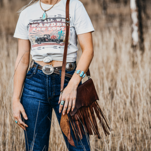 The Lakoda Mini - a beautiful mini bag that packs western punch! It’s perfect to carry your little essentials in style. Compact and stylish, made for those that wish to carry light... phone, card holder, glasses and lippie.  Roxy West Collection. Western inspired design, expertly handcrafted by our leather artisan makers in genuine Italian leather. This leather is absolutely beautiful, soft to the touch and even better in person