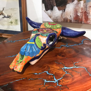 Mexican Art. New arrival.   Add some pop to your western or southwest decor with this hand-painted Mexican cowskull.  Display it on your wall, table top or floor.  Each one is unique and an original. Handcrafted by Artisans in Mexico. Size approx: 30 x 30 x 12cm.
