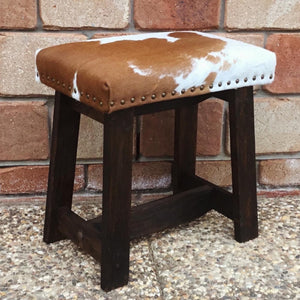 Give your living space a dose of natural  beauty with this modern-rustic foot stool.  Made at Swan Creek; we handcraft these foot stools from Aussie woods; finished with smoked-amber stain. Then custom upholster with cowhide and accent with trim of Mexican nail-heads. (Cowhide cushion top with foam inner) @swancreekinteriors AUS.