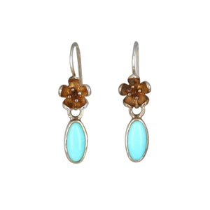 Rare AAA Grade 100% natural Sleeping Beauty Turquoise earrings in .925 sterling silver.  These stunning sleeping Beauty turquoise stones are hand set by artisan in sterling silver with gold patina! The amazing Sleeping Beauty stones measure 6x10mm.   Earrings cast floral earwire is 1.2" in length!