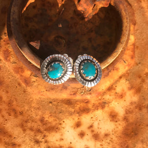 Southwest Stunners! Super Rare Teal!  Natural teal blue Fox Turquoise stones from Nevada .65" in overall length.  The Style: Natural shaped setting with full Southwest etch work. Artisan made in New Mexico in pure sterling silver. Stud fitting with vintage butterfly clasps. Measures 10x8mm. These silver stud earrings are made to be comfortably worn, loved and admired.