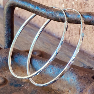 Not to big ot to small these elegant hoops are perfect for everyday.  Artisan made in .925 Sterling Silver. The gorgeous diamond textured finish brings dimension to these understated earrings.