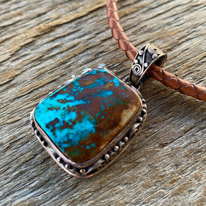 This large vintage pendant is stunning and even better in person.  * Pendant ~ Royston Turquoise with intriguing rich blues and copper brown matrix. {Nevada} Cabochon is set in handcrafted .925 sterling silver decorative pendant and bail.  Overall this pendant measures 1.75" ~ 27x24mm stonesize. One of a kind!  Vintage Pre 2000