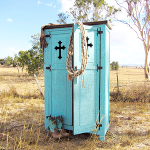 Cowgirl style - Country charm  This rustic armoire style cupboard features a striking rusticated turquiose chalk-paint finish and cutout Cross motif. Rough sawn wooden top with a smoky-amber stain. Made from sturdy Brazilian pine.  Add add pop of vibrant turquoise to any living space or brighten up your little Cowgirl’s bedroom. Inner wooden adjustable shelving to display your Boots, Barbies or Bronx riding gear!