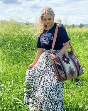 It’s the perfect bag that’s big enough for all your weekend essentials.  THE BAG- Made from authentic wool saddleblanket with beautiful colour and striking southwest design. Imported El Pas TX.  THE STRAP- Roxy West stamped. Handcrafted black leather belt strap with belt buckle set that’s adjustable to suit your style. Made by us here in Australia.