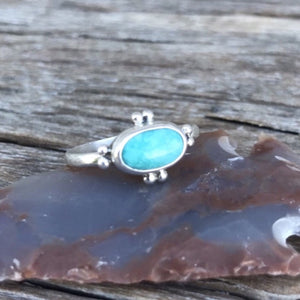 The Stone: A natural Royston Turquoise gem with a full matrix of azure blue and natural accents.  The Ring: Dainty oval shape in .925 silver, Southwest detail and simple silver band. Artisan crafted in Australia using quality USA/Arizona Turquoise. ‘One of a kind’. Easy to wear.