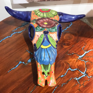 Mexican Art. New arrival.   Add some pop to your western or southwest decor with this hand-painted Mexican cowskull.  Display it on your wall, table top or floor.  Each one is unique and an original. Handcrafted by Artisans in Mexico. Size approx: 30 x 30 x 12cm.
