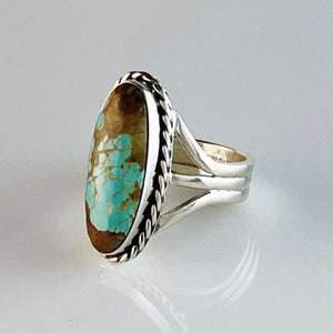 Get your hands on this stunning Vintage Ring. It’s has an exquisite Turquoise stone, you won’t want to take your eyes of it.   Made by Navajo artist Alfred Joe, this ring is set with boulder turquoise. The oval cut stone is set in a smooth sterling bezel and accented with sterling twist rope.  Heirloom item. One of a kind collectors item to be worn, admired and treasured.