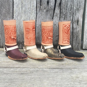Set of Authentic Bandito ‘Six Shooter’ Boot Shot Glasses.   Perfect to enjoy drinking tequila or mezcal with your best buddies or in that special occasion.  Boot made with carved leather scene, snakeskin leather & inner shot glass.  Set of 4 mixed colour. Height 12cm. Handmade in Mexico. 