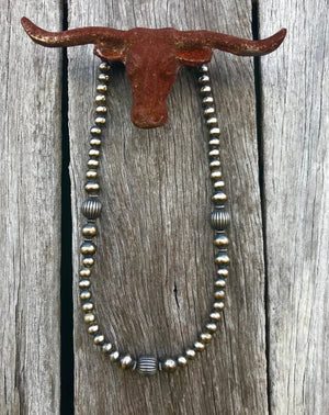 This gorgous design is the 14” strand of 5, 6 and 8mm Navajo Pearls with desirable southwest pumpkins beads.   The clasp comes with a 1" extension chain so you can play with the length a little. 