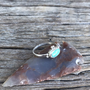 The Stone: A natural Royston Turquoise gem with a full matrix of azure blue and natural accents.  The Ring: Dainty oval shape in .925 silver, Southwest detail and simple silver band. Artisan crafted in Australia using quality USA/Arizona Turquoise. ‘One of a kind’. Easy to wear.