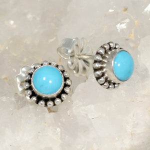 Southwest Beauties!  Sleeping Beauty Turquoise from Globe, Arizona. AAA Grade American Turquoise in natural bright blue!  Elegant 1/2" in length, in .925 sterling silver with Southwest style settings. Stone size 7mm, overall earring length with hand crafted posts studs.  Handmade by Artisan.