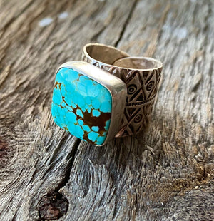 Collectors Turquoise. One of a kind. Exquisite.  Vintage No #8 Turquoise cabochon mined in Nevada in the 1980`s. The stone is cushion set with uniquely detailed sterling silver band. Large 17.5mm stone with exquisite sky blue colour and matrix spider webbing.  Adjustable Cigar band ring from size 7 to 10. Ring width tapers from 19.5mm at the center to 8.9mm at the back. Very comfortable to wear. Fit medium to large fingers. AUS @swancreekinteriors