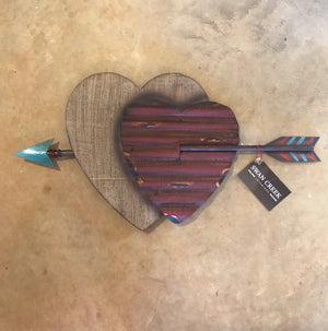 Add some Southwest spice to you home, patio or outdoor area with this Double Heart & Arrow wall art.  Ready to hang on a nail or hook.  24” Rustic look. Metal and painted polyresin. Size (Inches): 12 X 23 Imported Dallas Tx.