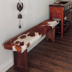 Made @swancreekinteriors Australia. Give your living space a dose of natural beauty with these modern-rustic bench seats.  Perfect as a pair on either side of the dining table, place at the end of the bed or for comfortably sitting on when putting your boots on.  We handcraft these bench seats from native woods; finished with smoked-amber stain. Then custom upholster with cowhide and accent with trim of Mex nail-heads. (Cowhide cushion top with foam inner) 