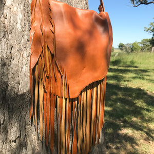 The Lakoda, a modern-cowgirl style handbag. It has the signature natural leather flap and fringing. The signature size handbag to carry your ‘everyday’ essentials in style. It’s not to big and not to small..it’s just right!  Roxy West Collection 