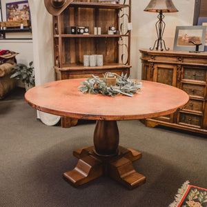 Give your dining room a dose of natural beauty  Luxurious 54’’ hammered natural copper rimmed top and solid wood pedestal base with dark oak satin finish that’s complements the copper. 