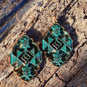 Sexy Southwest Earrings  These have always been an best seller. Stunning chevron ‘cutout design’ with teal~blue patina on copper accent.  New Mexico. Copper hardware. Statement size 6.2cm x 6.9cm. The cutout does makes them lighter weight to wear comfortably.