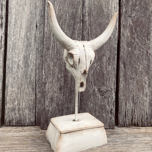 Bull skulls are an attractive elements that brings a rustic touch to any space.  Rustic Bull Skull on stand.