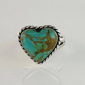 This adorable heart ring was made by Navajo artist Alfred Joe and is set with # 8 turquoise. The heart cut stone is set in a smooth sterling bezel and accented with sterling twist rope. Stamped.  Size of Setting: 3/4” by 3/4 ”Heirloom item.  One of a kind collectors item to be worn, admired and treasured. 