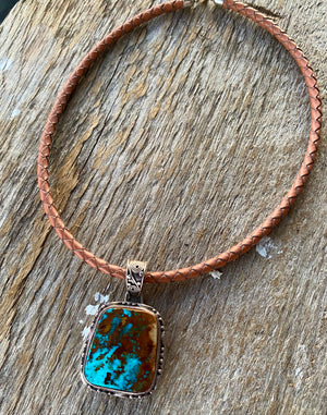 This large vintage pendant is stunning and even better in person.  * Pendant ~ Royston Turquoise with intriguing rich blues and copper brown matrix. {Nevada} Cabochon is set in handcrafted .925 sterling silver decorative pendant and bail.  Overall this pendant measures 1.75" ~ 27x24mm stonesize. One of a kind!  Vintage Pre 2000