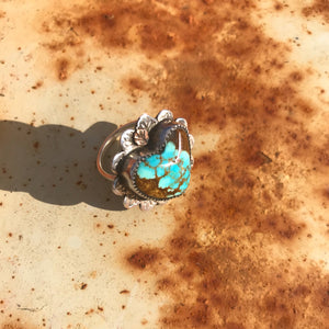 Get your hands on this Stunning Vintage Ring.  Gorgeous * very rare * vintage #8 Mine Turquoise carved into a 3/4" Southwest ring. 22mm polished heart cabochon set in handmade sterling silver rose petal setting with 18K Rose Gold accent!  Top Notch. One of a kind collectors item to be worn, admired and treasured.  Size 7.5 AUO (Medium) see our ring guide.
