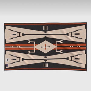 Traditional design, use this stunning saddle blanket in your home styling or under your show saddle.  A USA-made wool blanket based on the story of the Eagle, the Elk and the Warrior, often told by Native American artist (and former Colorado Senator) Ben Nighthorse Campbell. In the story, a Cheyenne warrior saw an eagle trapped in an elk's antlers. After the man freed the eagle, the eagle thanked him with the gift of a beautiful stallion resembling the colors of the eagle's feathers.
